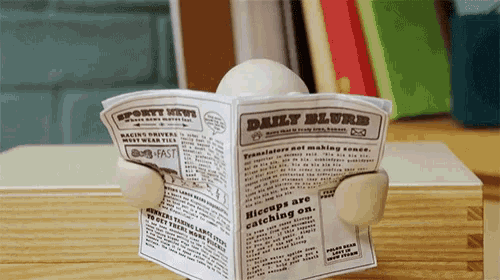 clay person reading the newspaper